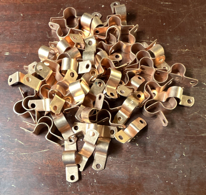 Lot of 1/2 inch copper  straps. 70 total pieces that have never been used.