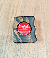 black and white Asian Ebony coca cola bottle opener