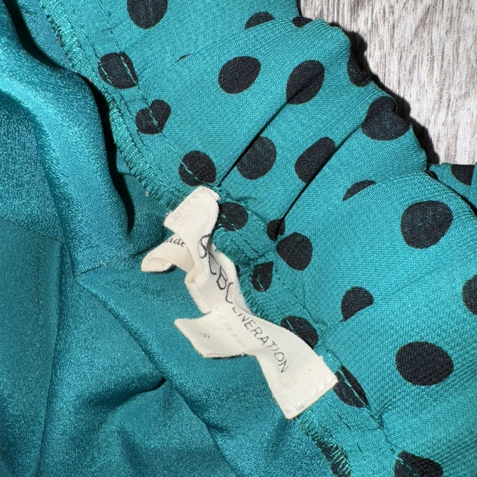 Mini-saia BCBGENERATION preta e verde bolinhas tamanho P (3) - Imagem 2 de 2