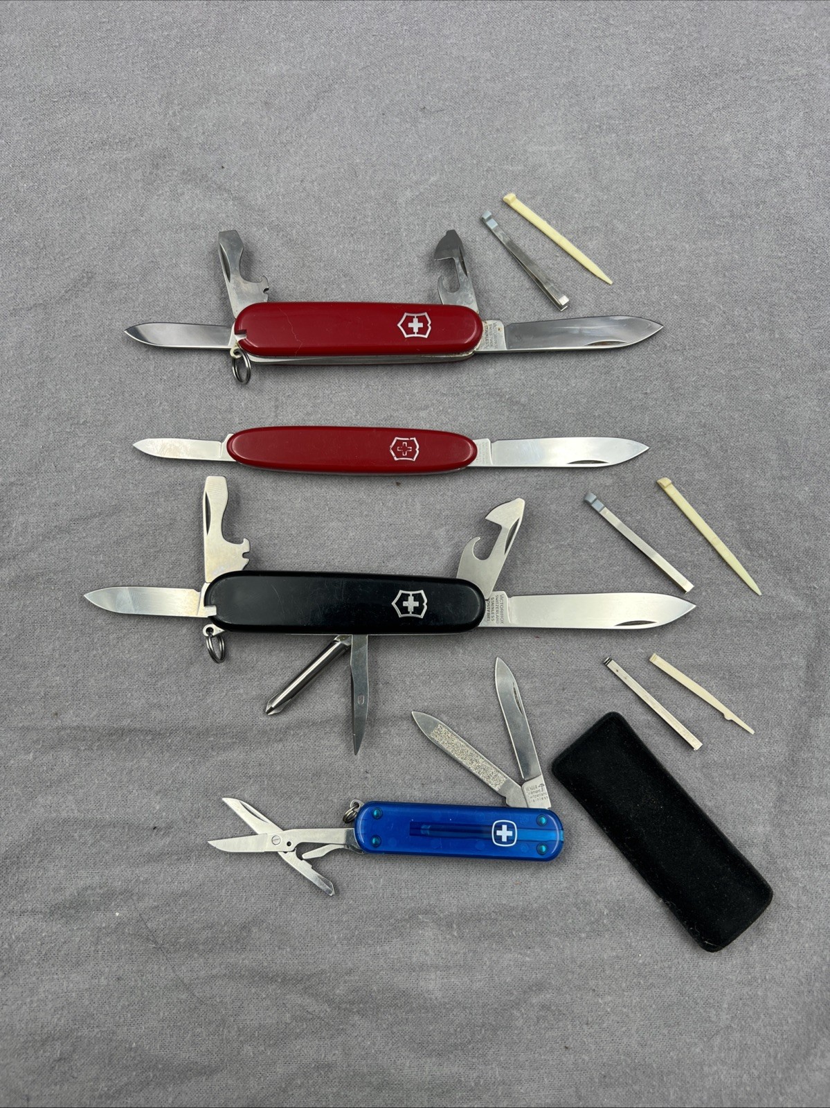 4 Wenger & Victorinox Swiss Army Knives - Red, Black, Blue