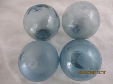 4 Alaska Beachcombed Japanese Glass Fishing Floats with Blue color in the Seals