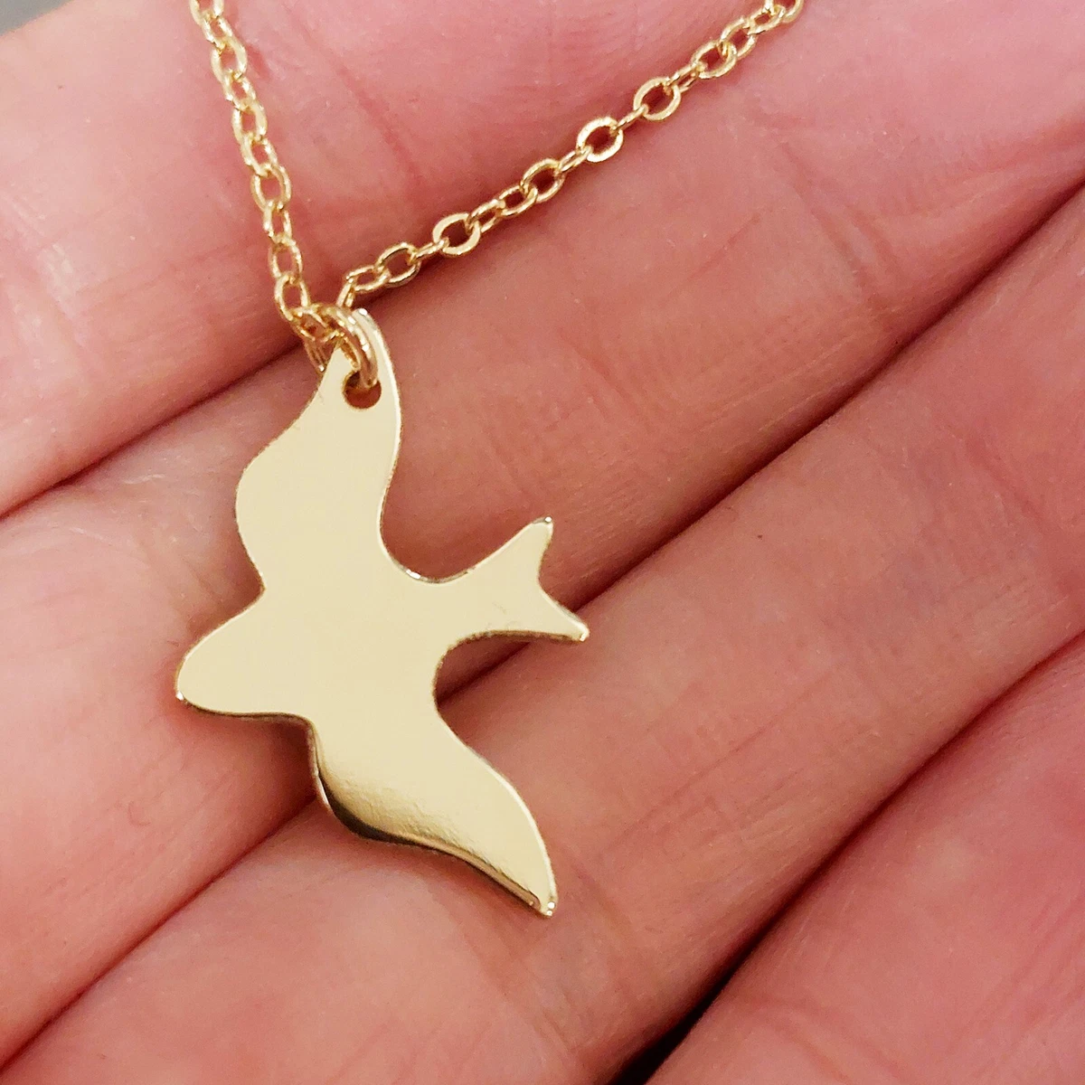 Flying hotsell bird necklace