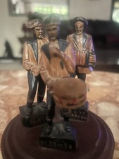 Wood carved musical trio