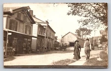 c1910 RPPC Wiard Plows Sign Man Woman Stores Horse Buggy Real Photo  P818