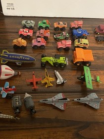 Vintage Micro Machines over 60 Mini Cars, Monster Trucks, Planes, and road.
