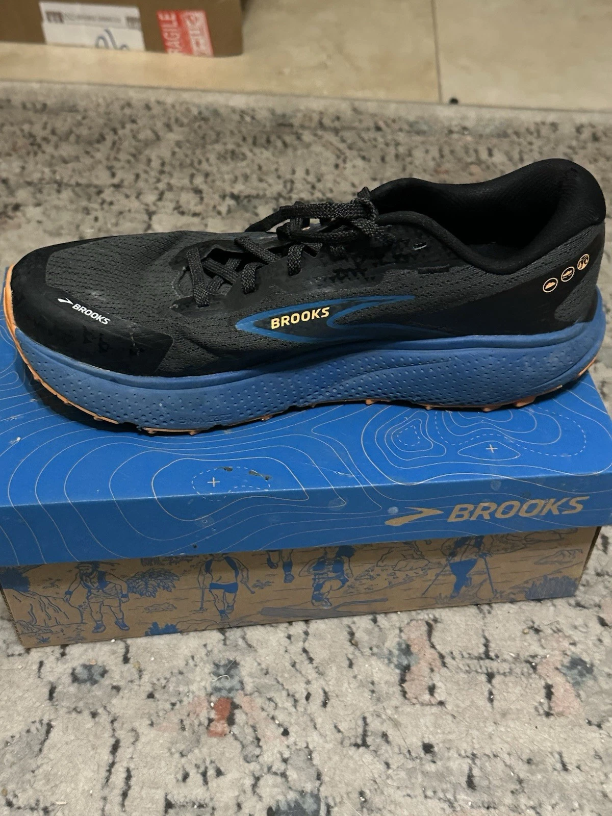 Brooks Men's Divide 5 trail running shoes in the Ebony/Blue Sapphire/Orange