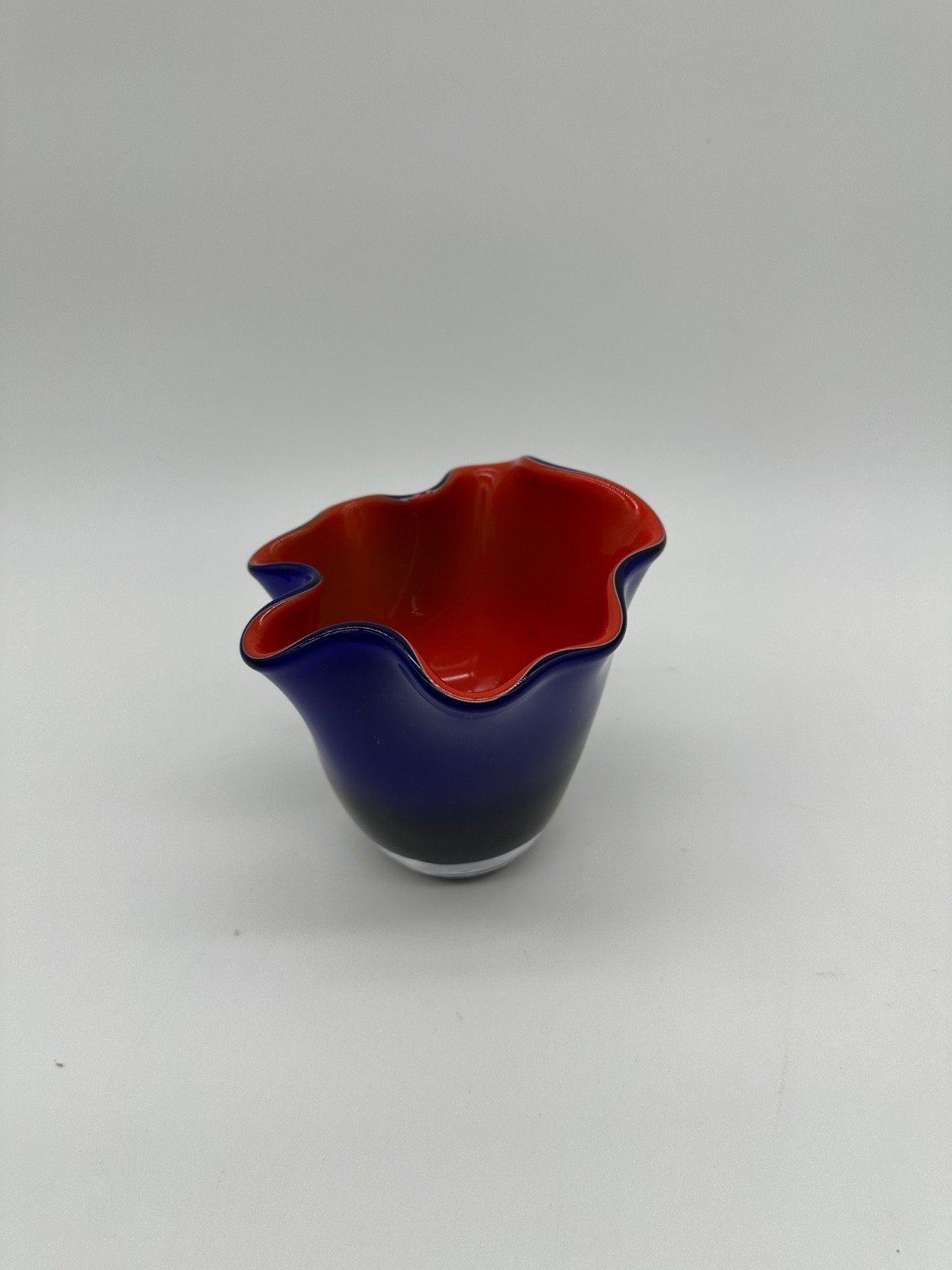 Cobalt blue red cased wave rim hand-blown art glass bowl. 4.5