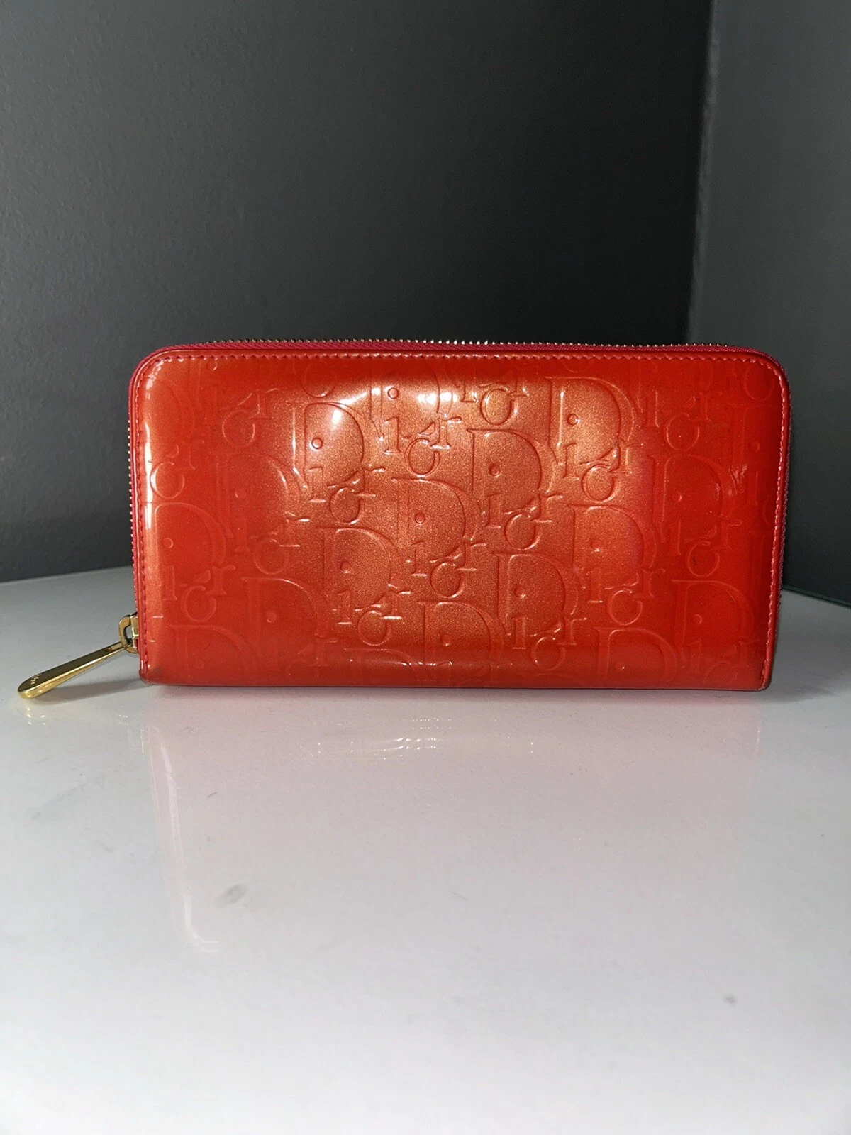 Authentique portefeuille zippé Christian Dior Diorissimo cuir verni rouge