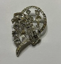 Vintage Coro Clear Rhinestone Encrusted Loopy Ribbon Silvertone Pin Brooch