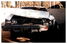 1990s Close Up Wrecked Front End White Cadillac Sedan Heavy Damage Vintage photo