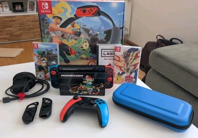 Nintendo Switch V2 Konsole Bundle + Ring Fit Adventure + Pokémon Schild 
