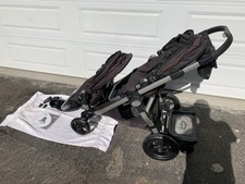 double stroller with skateboard