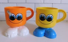 Pair Deka Vintage New Old Stock Footsie and Tootsie Smiley Face Mugs w/stickers