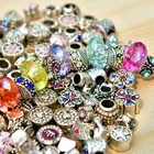 A box of various large hole spacer beads and metal alloy rhinestone DIY beads
