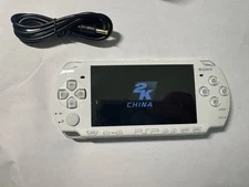 psp 2000 with charging cable and new battery
