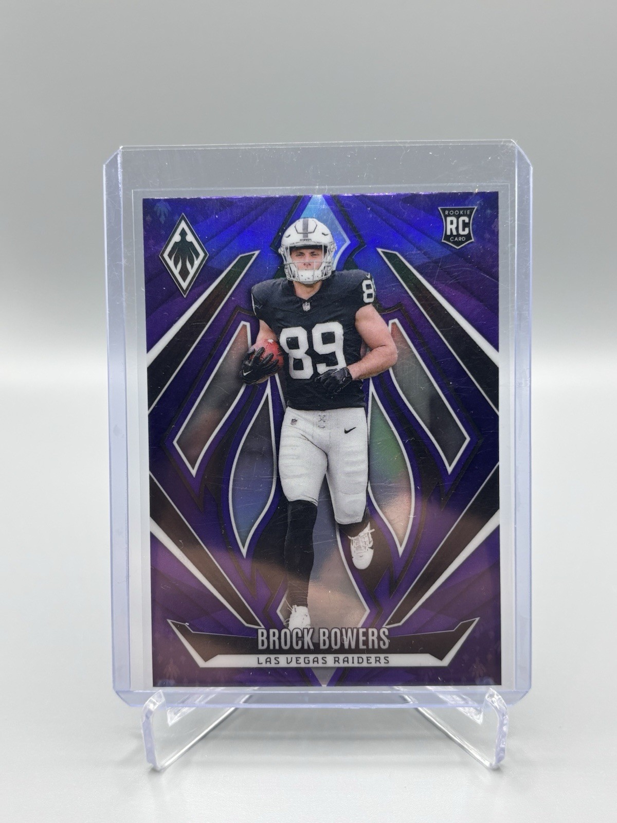 2024 Panini Phoenix - Rookies Brock Bowers #165 Purple (RC)