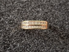 9 CRT Gold Eternity ring set with 18 Diamonds.