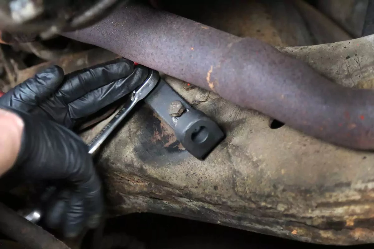 The new frame mount is bolted onto the frame with a box wrench.