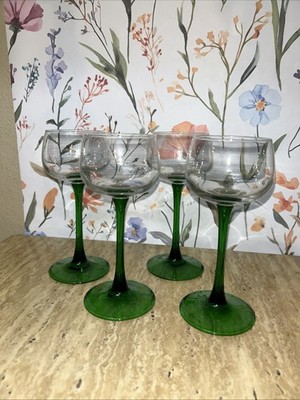 Set of four 6.5'' Luminarc emerald green stemmed wine glasses.