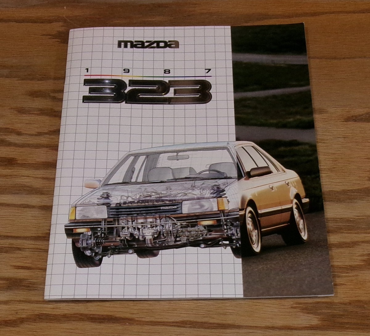 Original 1987 Mazda 323 Deluxe Sales Brochure 87 Hatchback Sedan