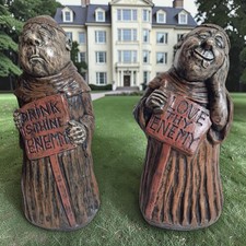Humorous pair of heavy concrete painted garden ornaments