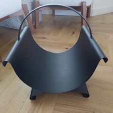 Black metal log-basket for fireplace