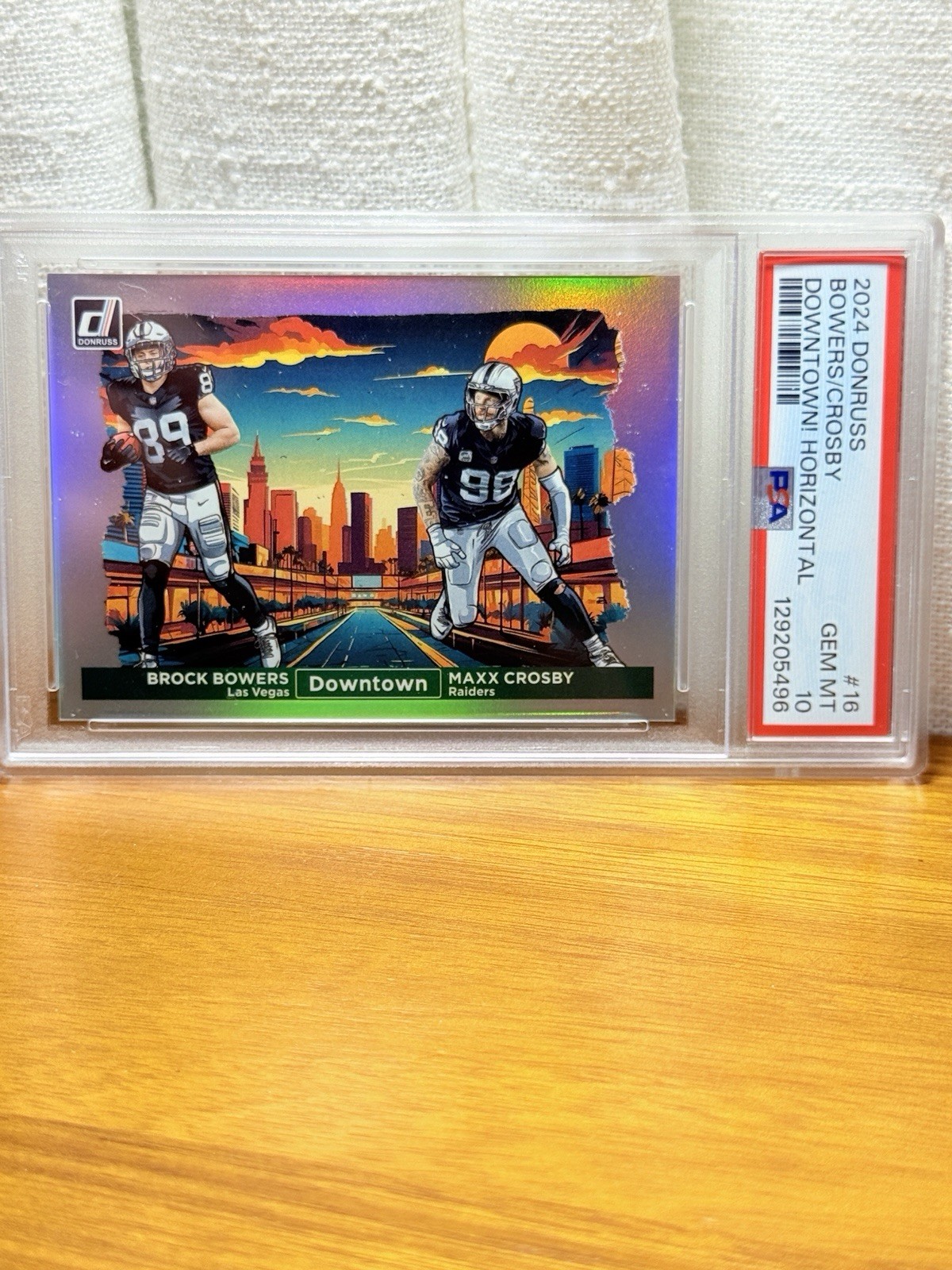 Brock Bowers / Maxx Crosby #16 Football Cards 2024 Panini Donruss Downtown Horizontal trading card — raw and PSA graded price guide