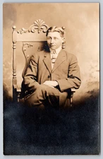 Postcard RPPC Young Man Seated Suit Leg Crossed Studio Portrait