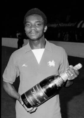 Leyton Orient winger Laurie Cunningham with a magnum of Lanson cha- Old Photo