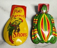 Vintage Poll Parrot Shoes Advertising Tin Lithograph Toy Clicker & Frog Clicker