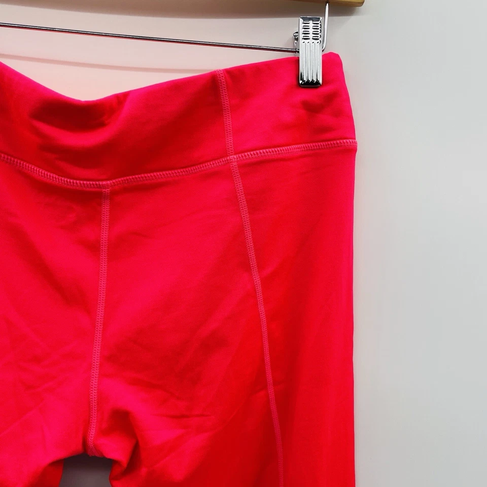 Pantalones al tobillo deportivos forrados de vellón reflectantes talla mediana Hind para mujer en rosa Foto 4 de 4