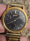 Vintage Seiko mens Watch V700-8A10 with black dial.