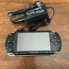 PSP 1001 + Official Sony Memory 1GB + Charger + New Battery + Tony Hawk Proj. 8