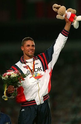 Dan O'Brien on the podium with his gold medal for winning the dec 1993 Old Photo