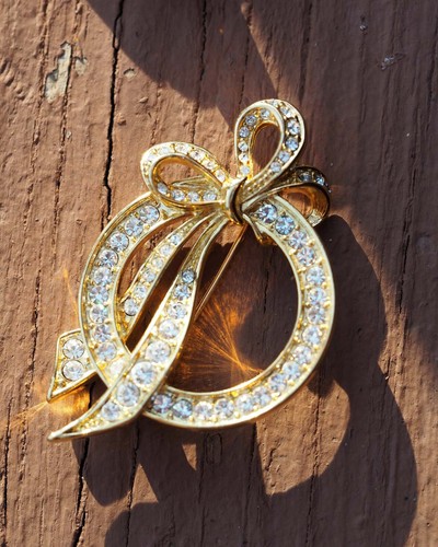 Vintage Nolan Miller Rhinestone Bow Brooch Signed Gold-Tone 1980s