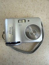 Nikon Coolpix L3 Digital Camera Silver Handheld Parts Only Broken Battery Cover