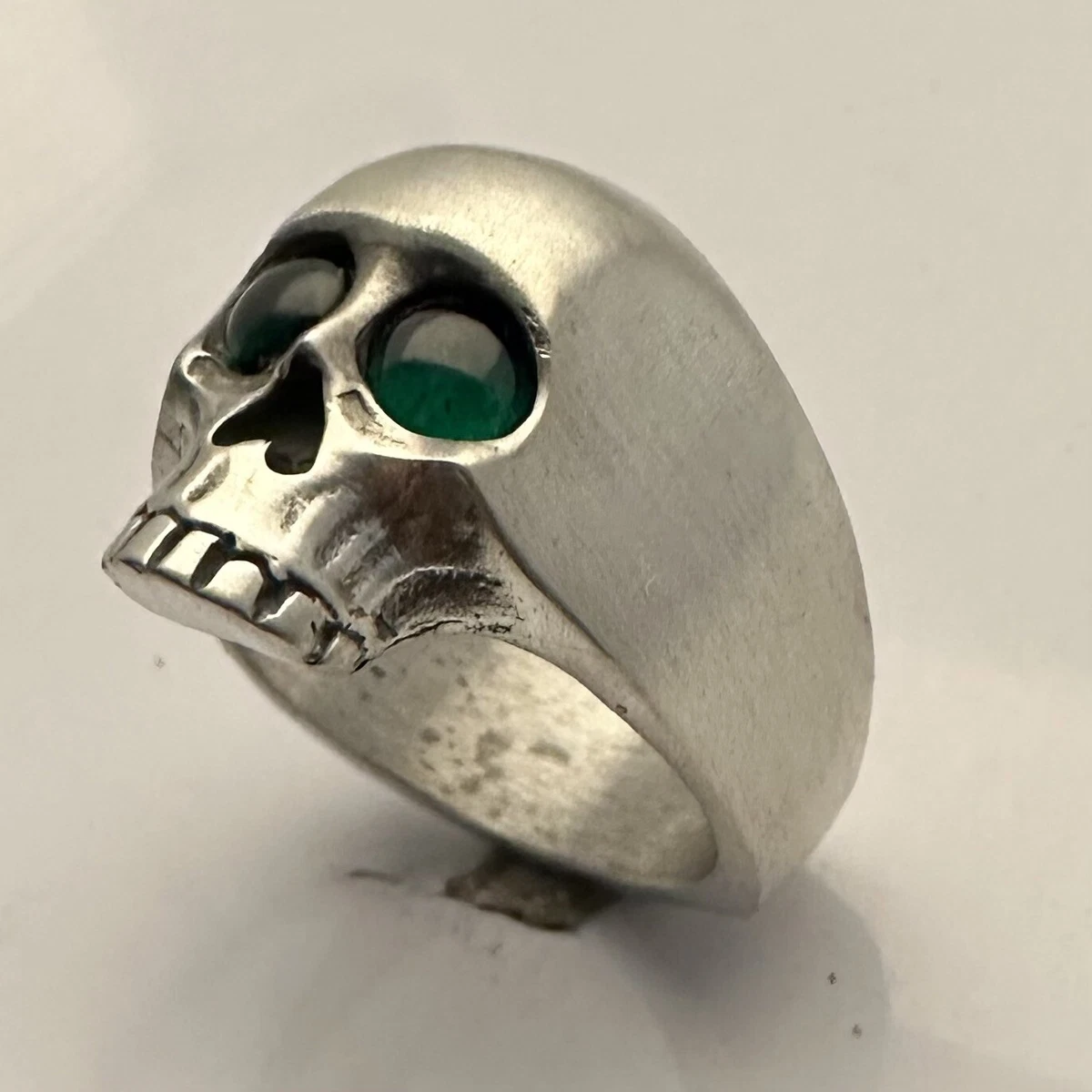 Skull ring with emerald on sale eyes