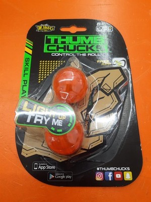       **DOESN'T LIGHT UP** Zing Thumb Chucks Skill Toy: Orange 