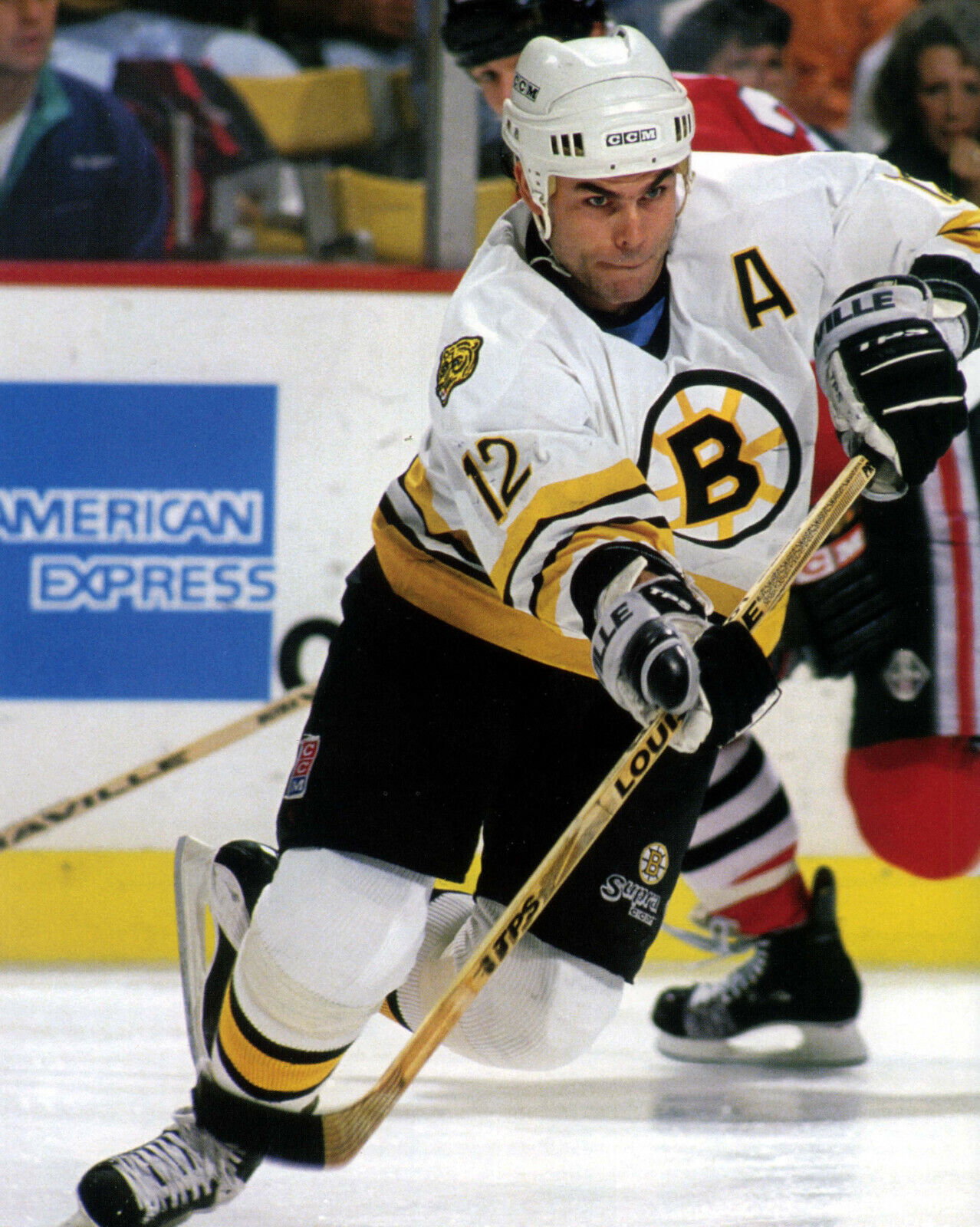 Adam Oates of the Boston Bruins skates on the ice during an NHL game