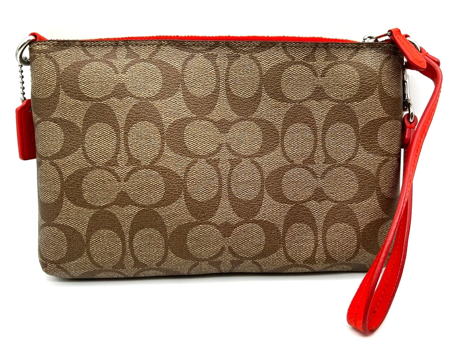 Muñequera Coach Signature Logo Pop Pouch naranja caqui para mujer Foto 3 de 4