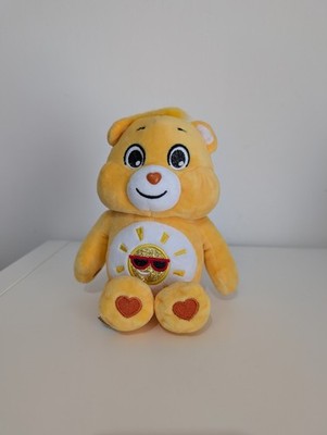Care Bears Unlock The Magic Funshine Bär gelb Plüsch Glitzer Bauch Abzeichen 10 Zoll