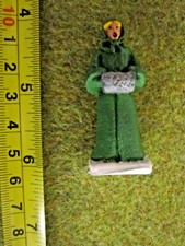 unknown-manufacturer-woman-in-green-cloak-with-muff-figure-village-miniature