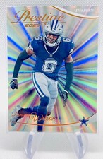2023 Panini Prestige Donovan Wilson Xtra Points Sunburst Parallel #81 - Cowboys