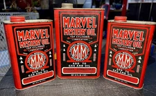 3 empty Vintage MARVEL MYSTERY OIL cans. 2 16 Oz cans and 1 32 oz can.