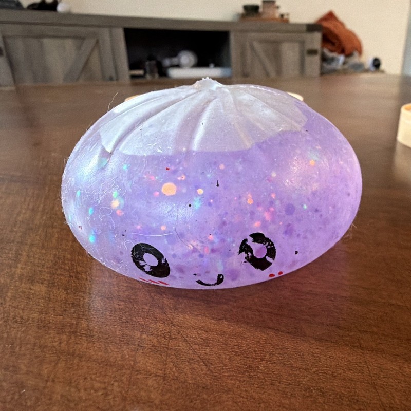 Purple Glitter Gel Squeeze Ball Stress Reliever Squishy Toy w/ Cute Face 4in