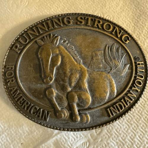 "RUNNING STRONG FOR AMERICAN INDIAN YOUTH." BRASS BELT BUCKLE