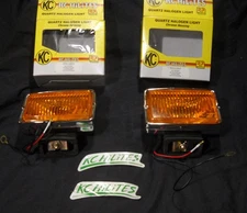 NOS Vintage NIB KC HiLites 1557 Chrome Amber Fog Lights set of two.