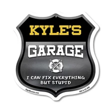 Kyle's Garage I Can Fix Everything But Stupid Shield Shaped Sign Made in the USA