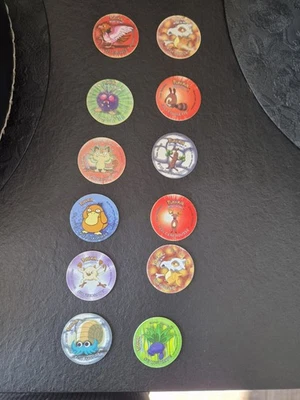 Pokémon lot de pogs/jetons illustrés en plastique (plusieurs pièces) - Photo 1/2