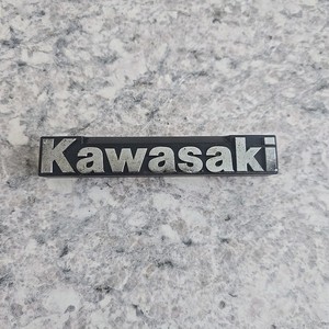 2004-2006 Kawasaki Prairie 700 OEM Front Fender Emblem 56052-1201